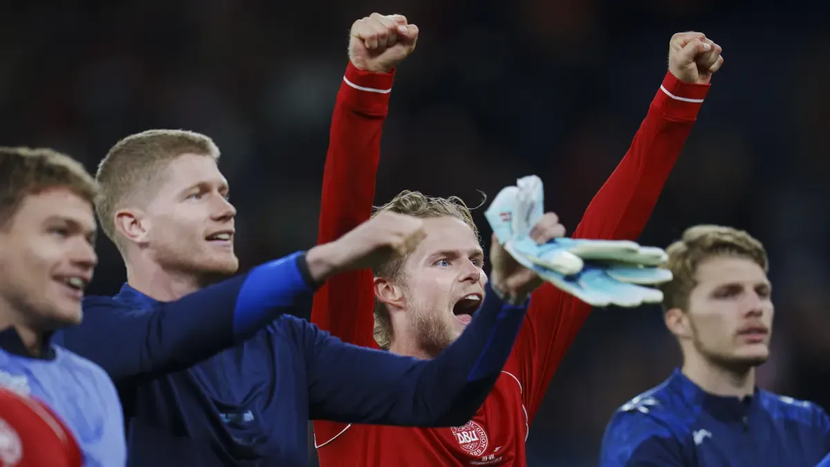 Morten Hjulmand and Denmark raise their heads after victory.