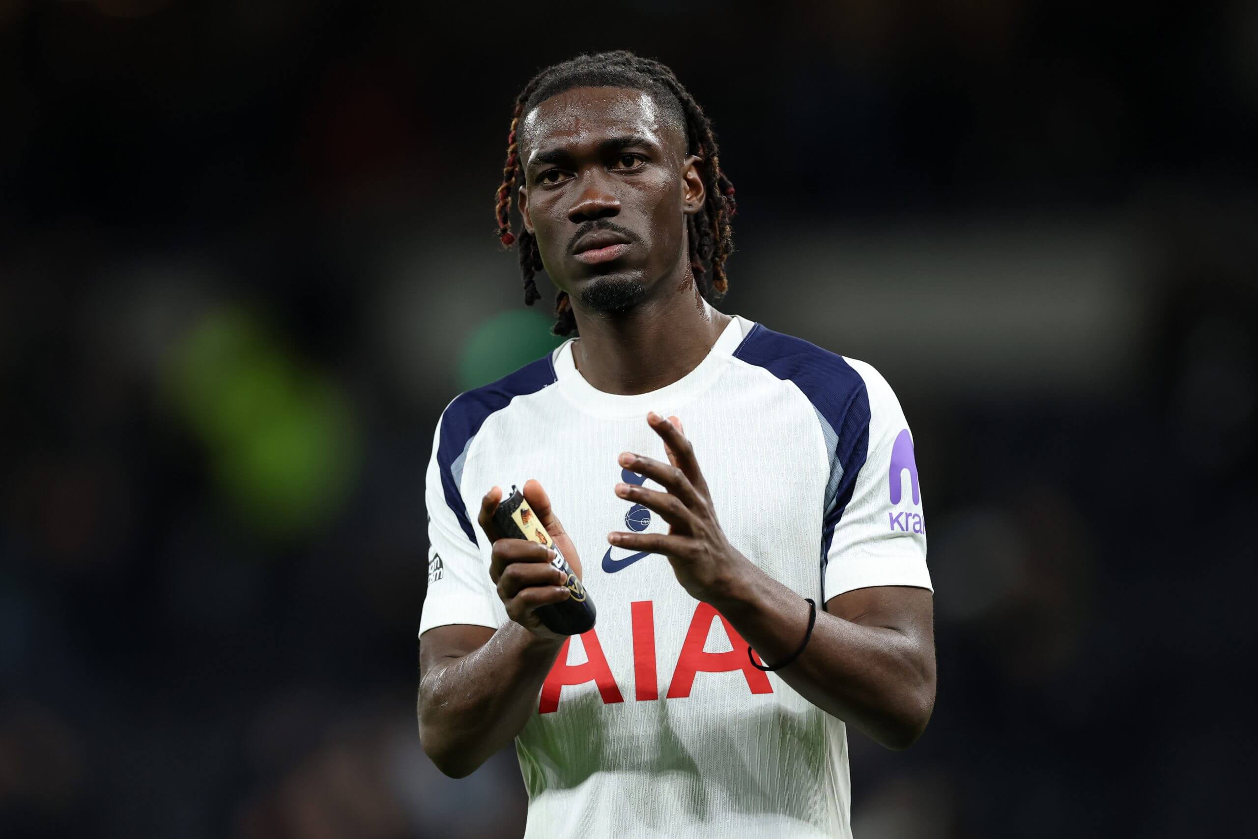 Yves Bissouma applauds the Tottenham support