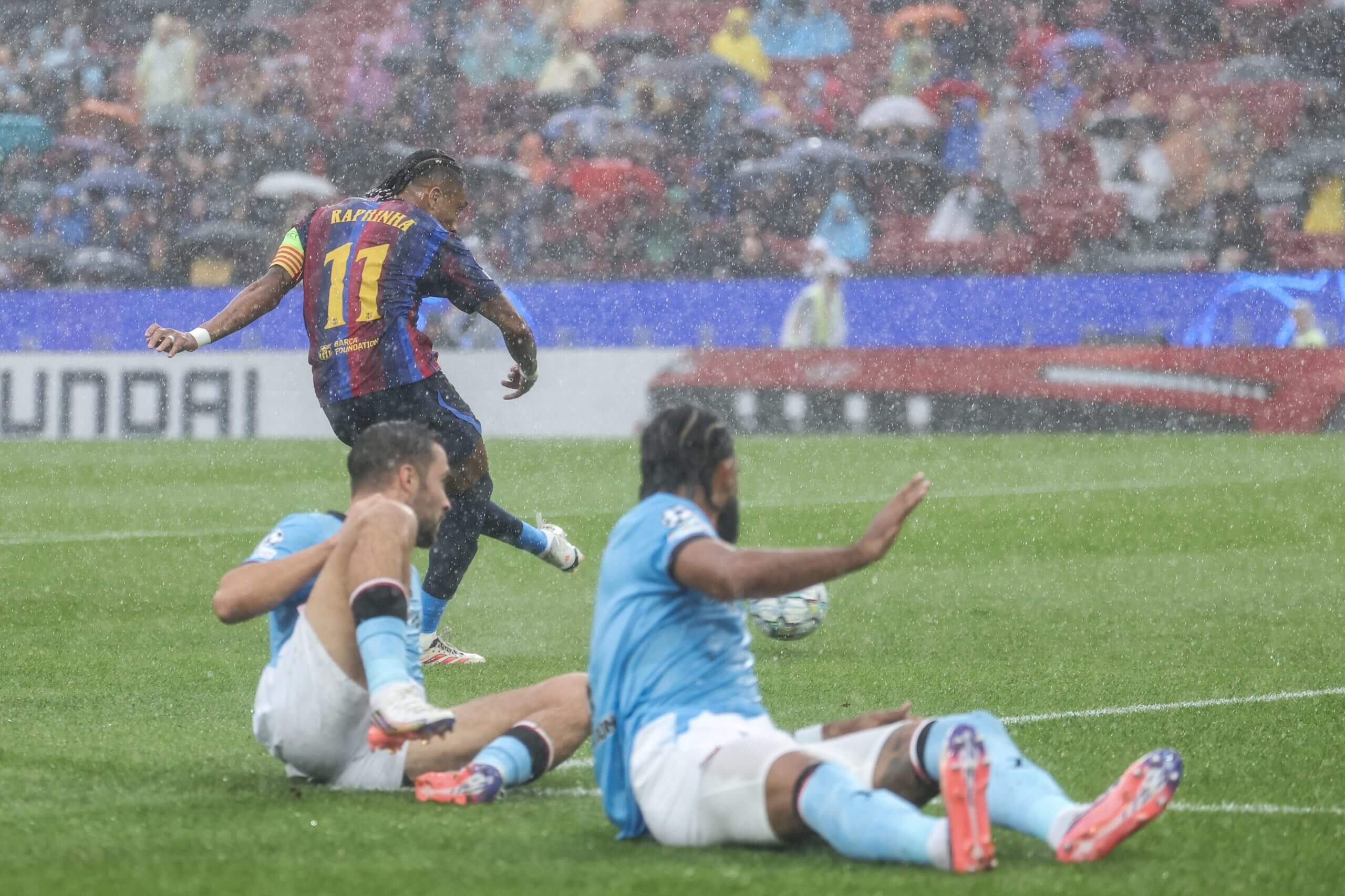 Raphinha scores as two defenders watch helplessly