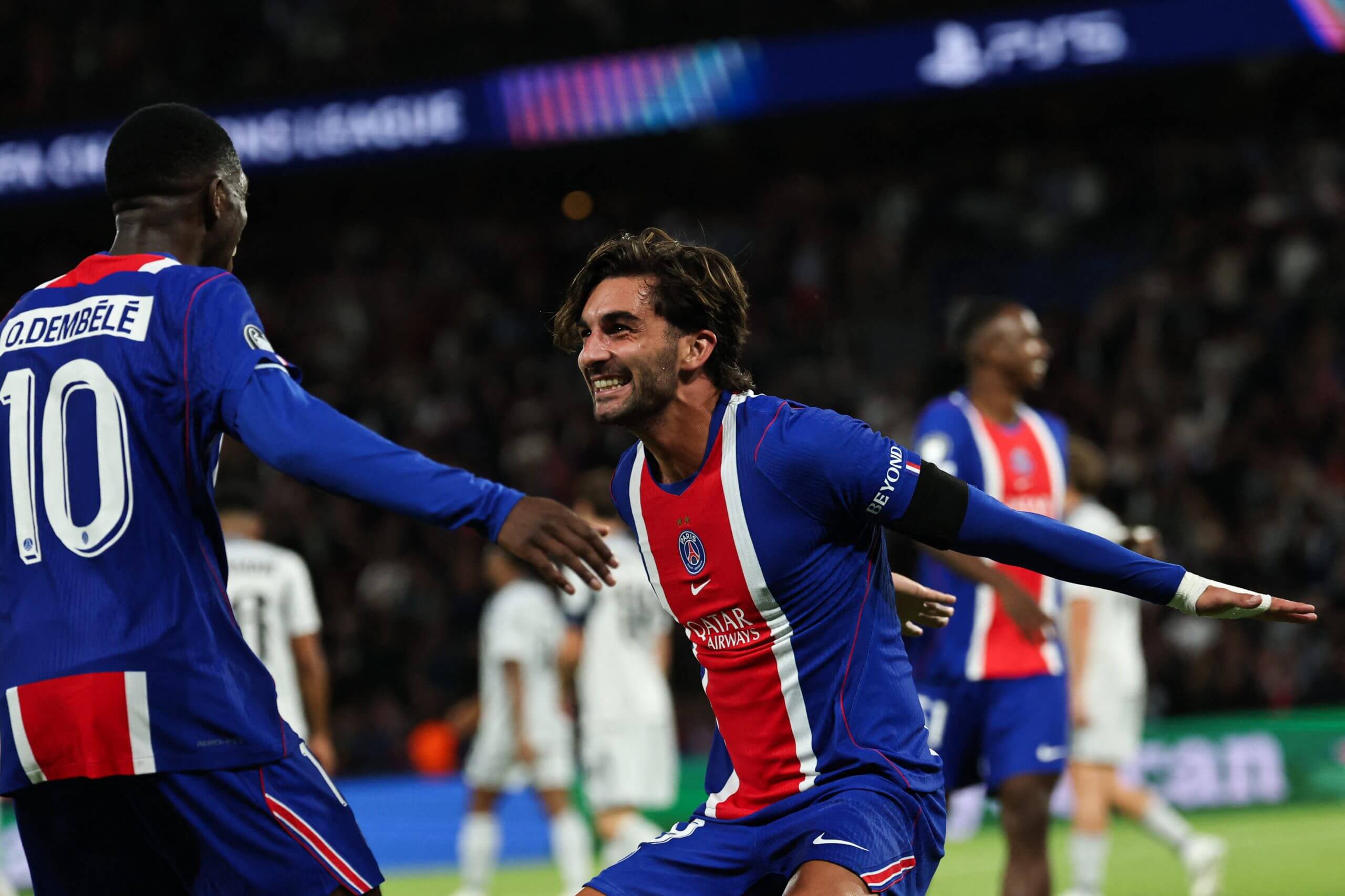 Ferran Torres celebrates alongside Ousmane Dembele