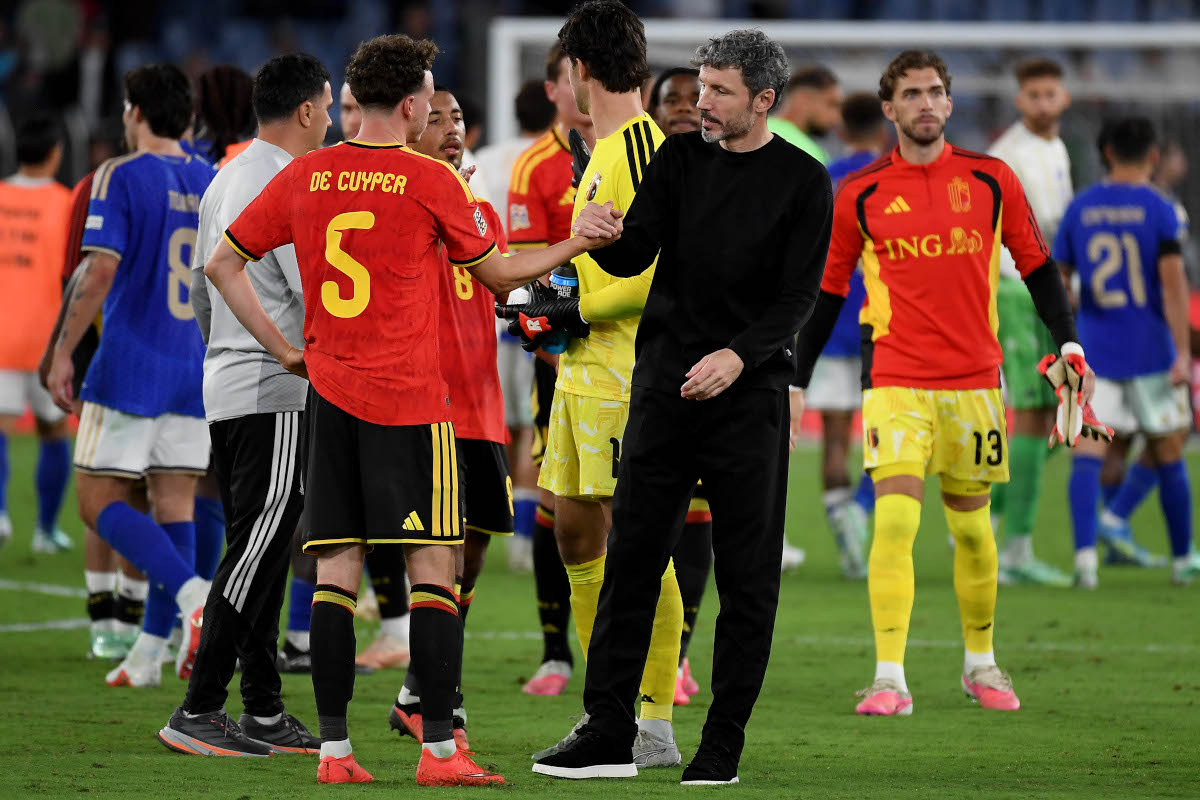 Mark van Bommel celebrating Belgium's 2‑0 victory over Italy in Rome.
