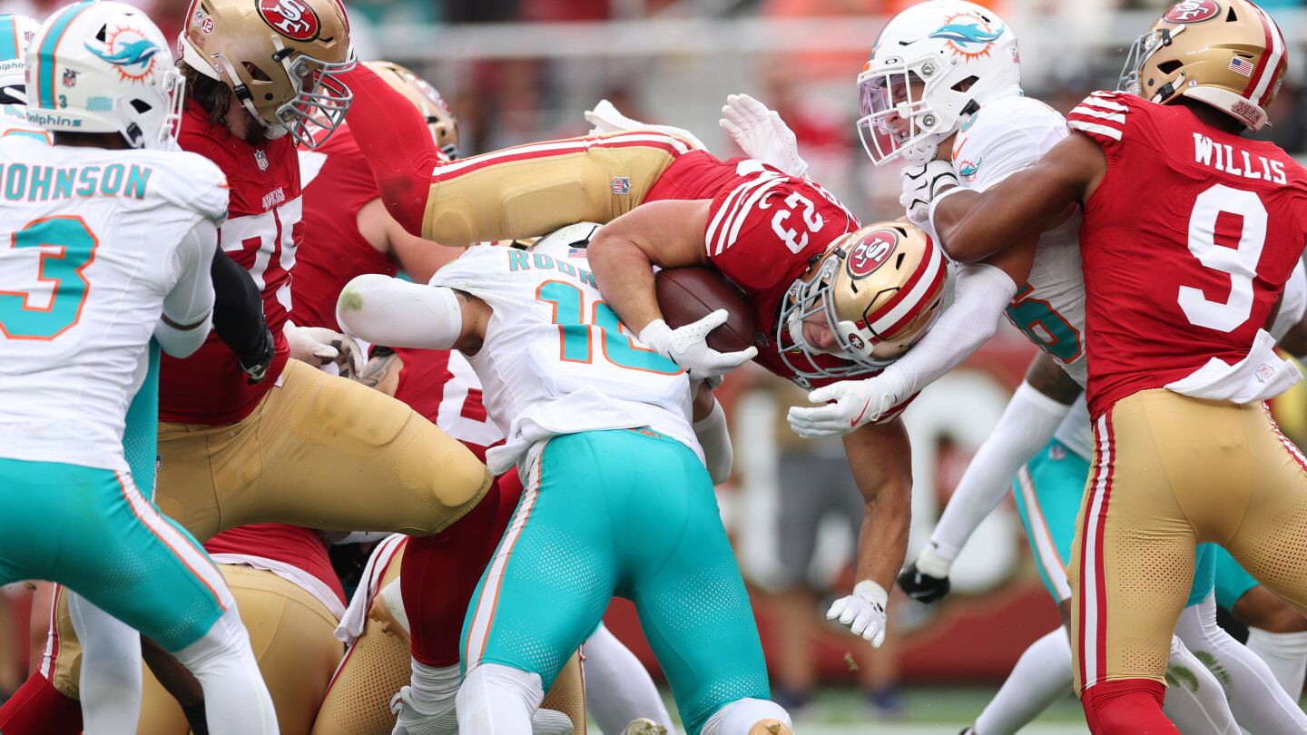Christian McCaffrey becomes one of three players with 50 touchdowns for two NFL teams