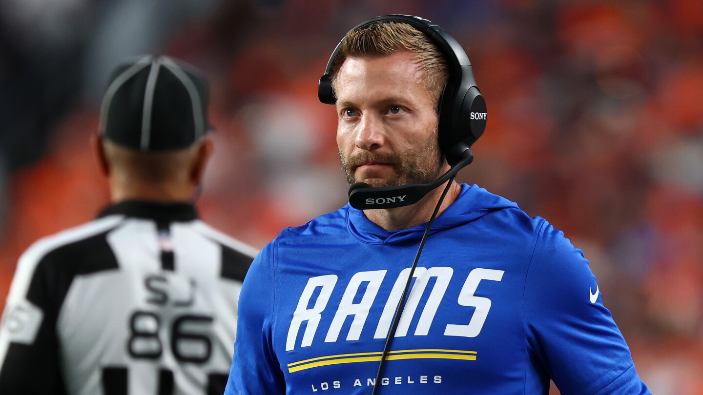 Sean McVay standing quietly after the Rams' loss to the Broncos.