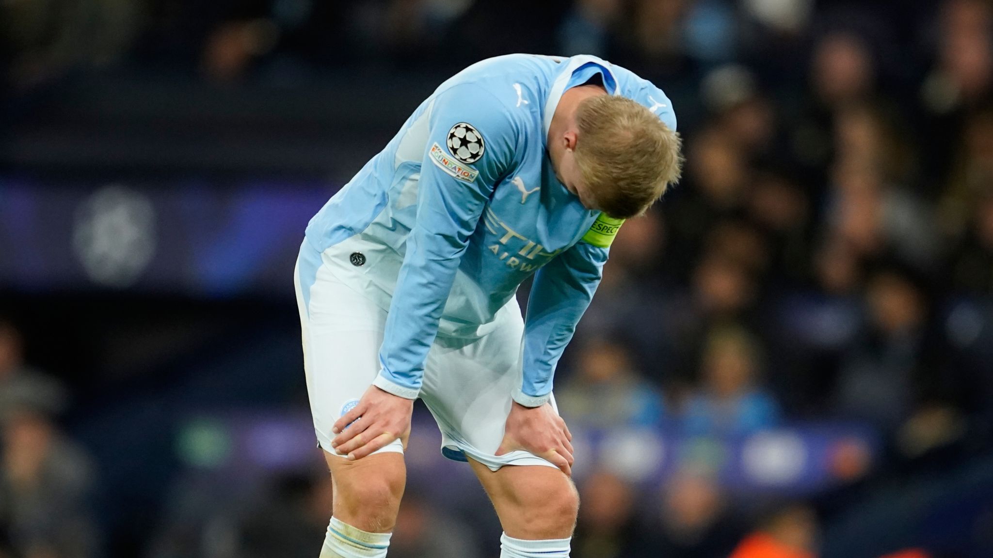Erling Haaland lowers his head following the defeat to PSG