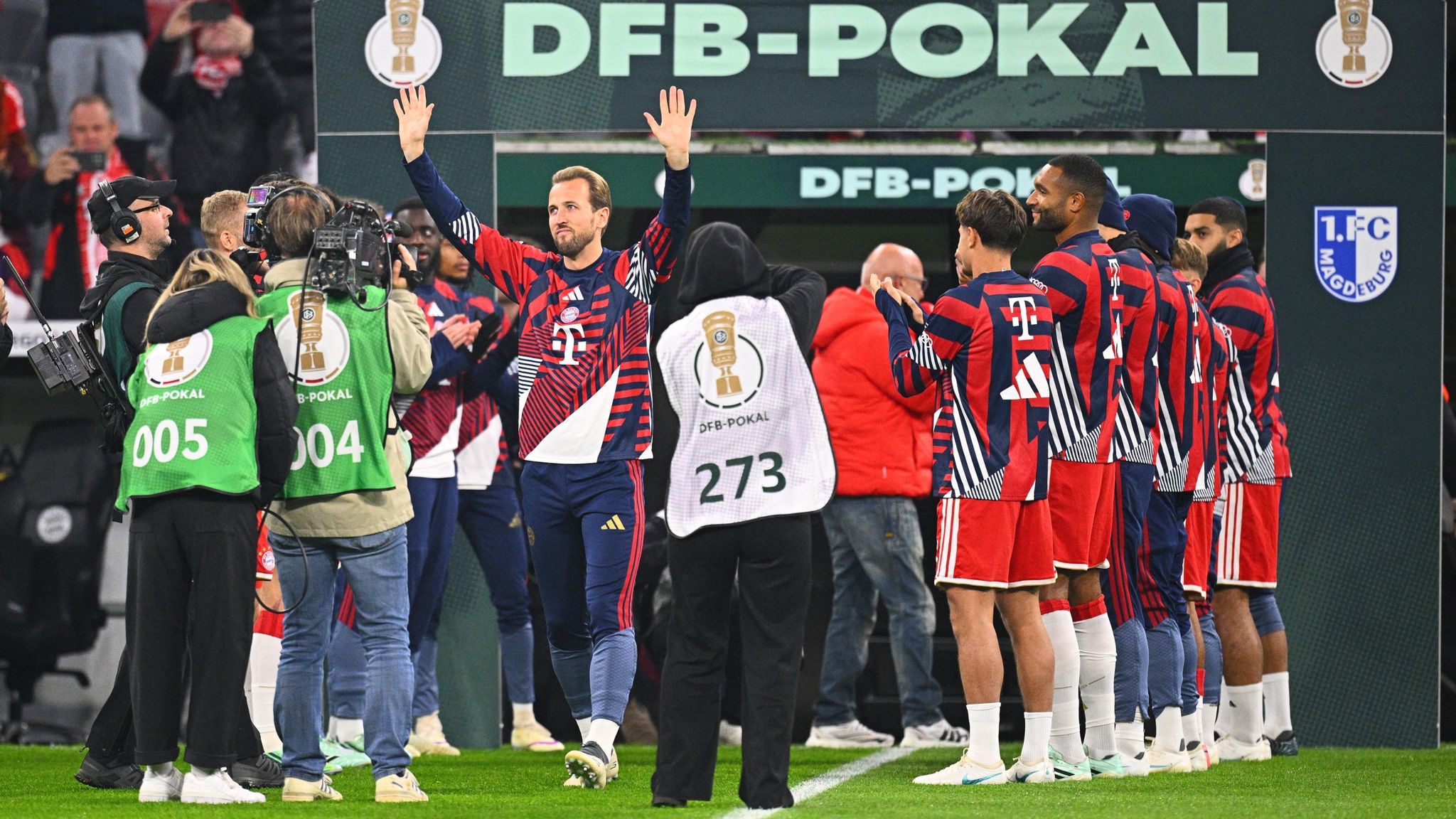 Harry Kane waves to the fans as he is given a guard of honour against Magdeburg