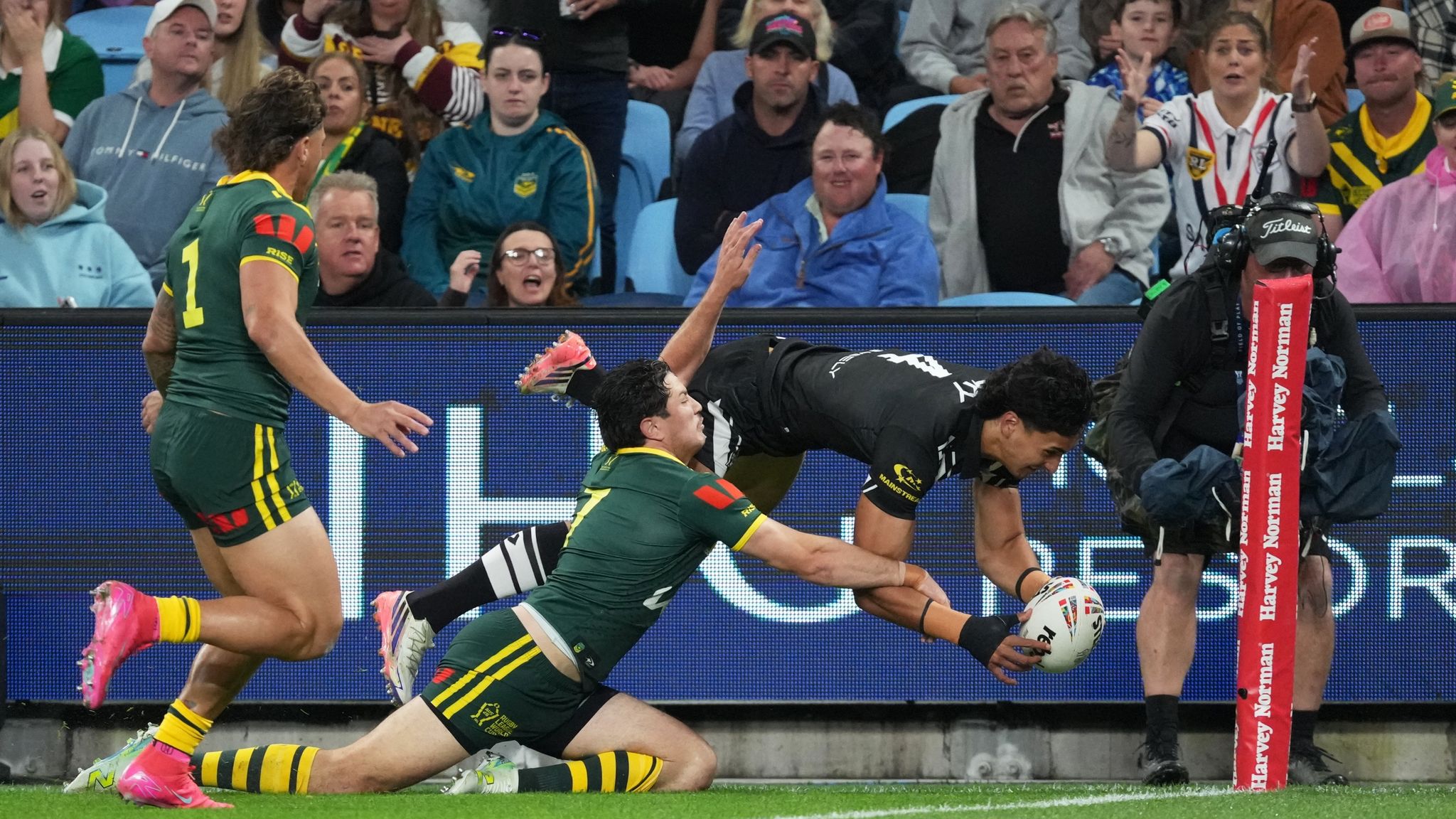Casey McLean diving in the corner to score for New Zealand against Australia (AP Photo/Mark Baker)